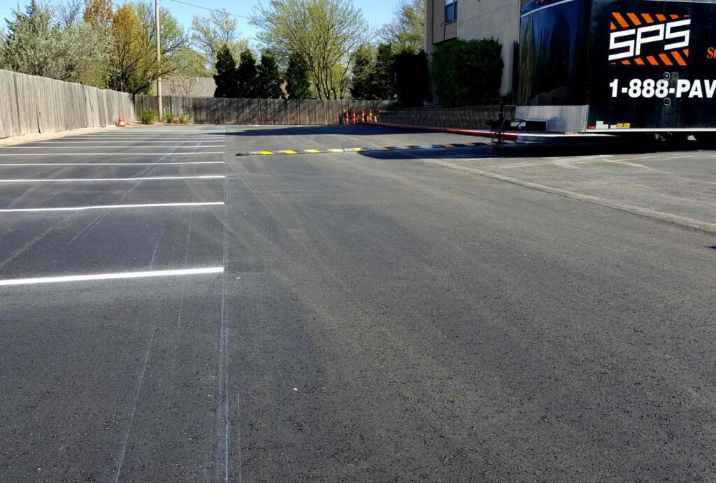 empty parking spaces and speed bump at horizon east apartments