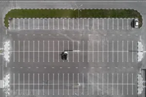 aerial view of parking lot with only two cars