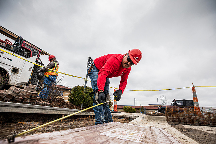 Wichita, KS, Concrete Company: Encore Pavement employees work on a concrete paving project.