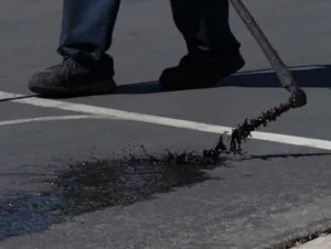 Our sealcoating process involves coating the pavement