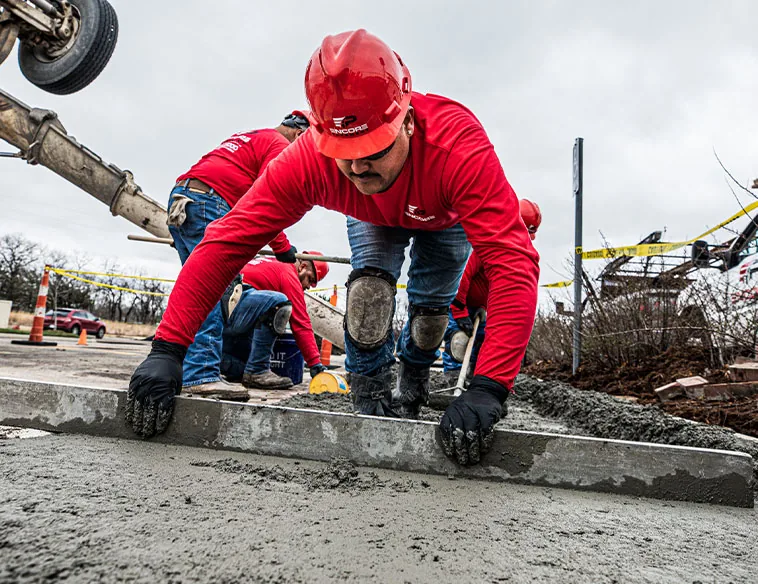 encore pavement employee working with concrete