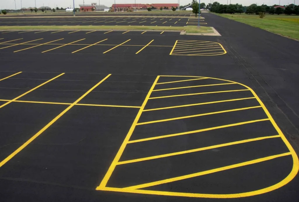 freshly painted yellow parking lot lines at maize high school in maize kansas