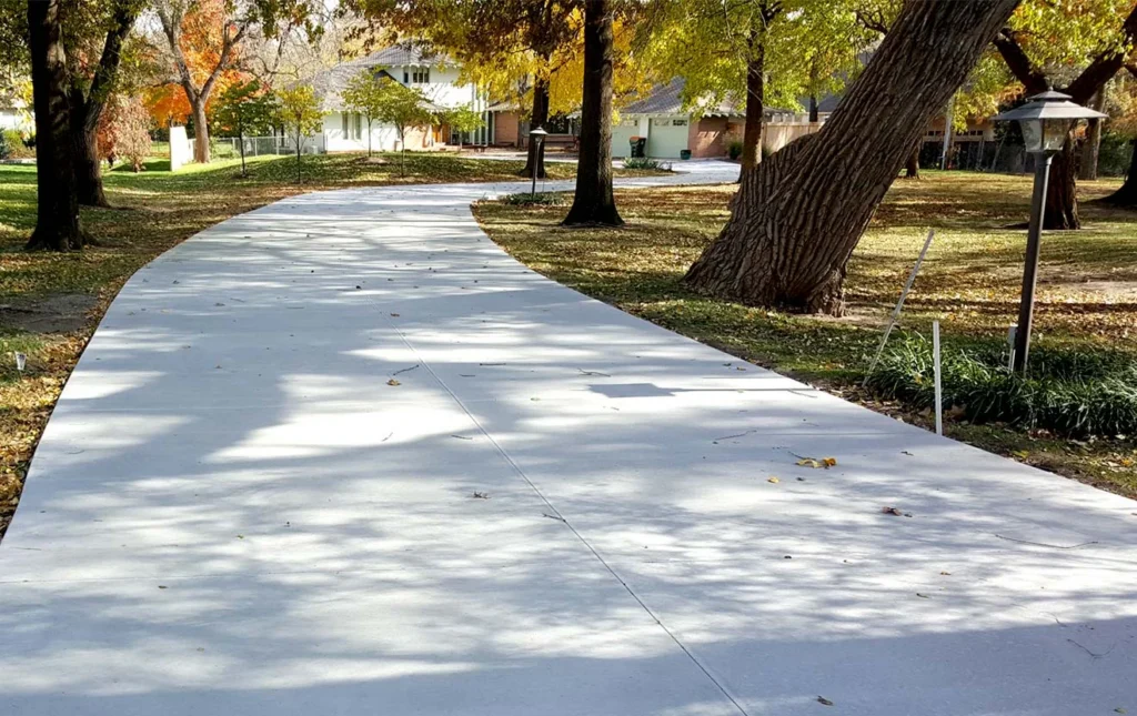 Freshly laid large residential concrete driveway.