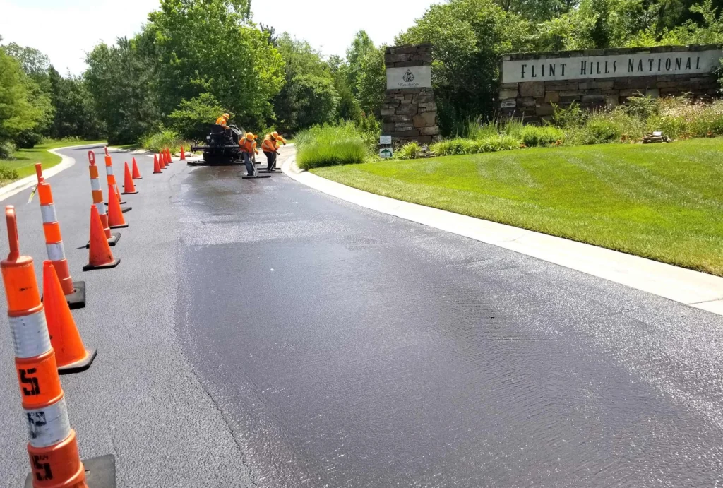 encore pavement employees working on a street
