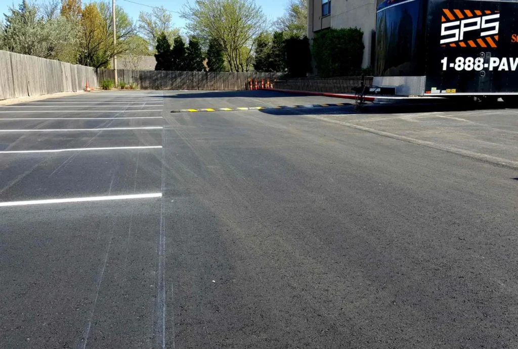 empty parking spaces and speed bump at horizon east apartments