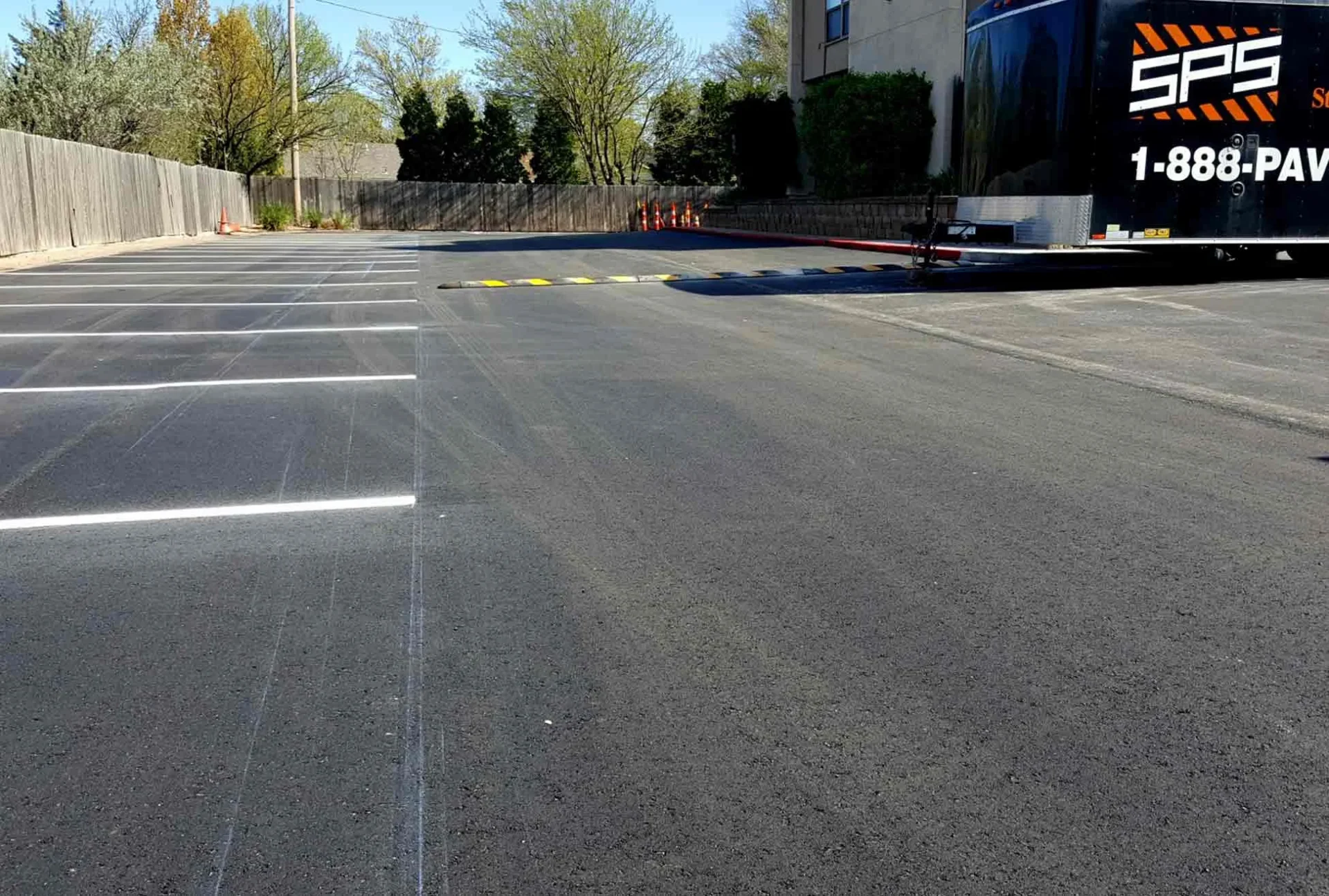 empty parking spaces and speed bump at horizon east apartments