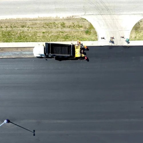 birdseye view of encore pavement dump truck