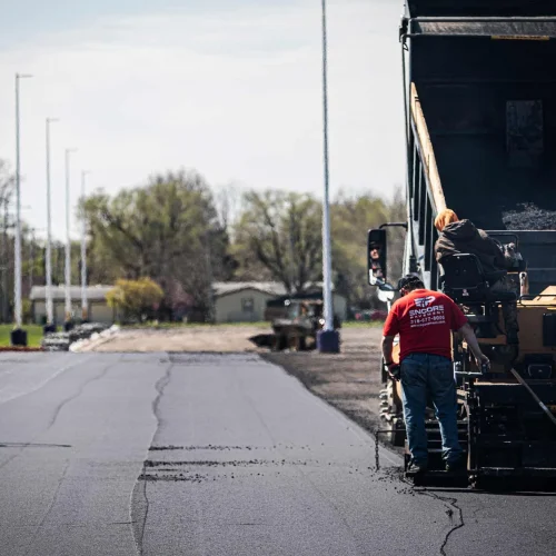 encore pavement employee outside of a truck