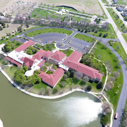 birds-eye view of spiritual life center and pond