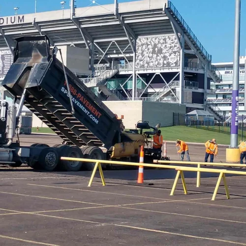 encore pavement dump truck at bill snyder stadium