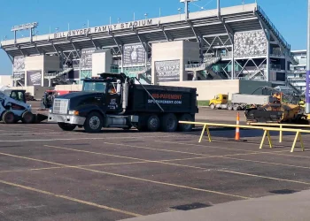 encore pavement dump truck at bill snyder stadium