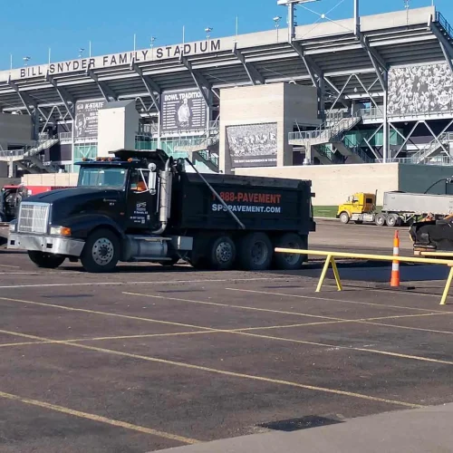 encore pavement dump truck at bill snyder stadium