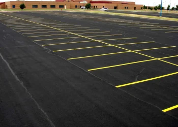 freshly painted yellow parking lot lines at maize high school in maize kansas