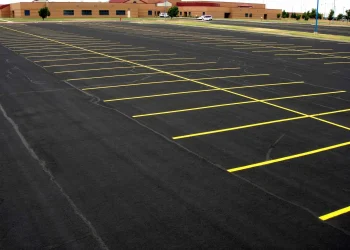 freshly painted yellow parking lot lines at maize high school in maize kansas