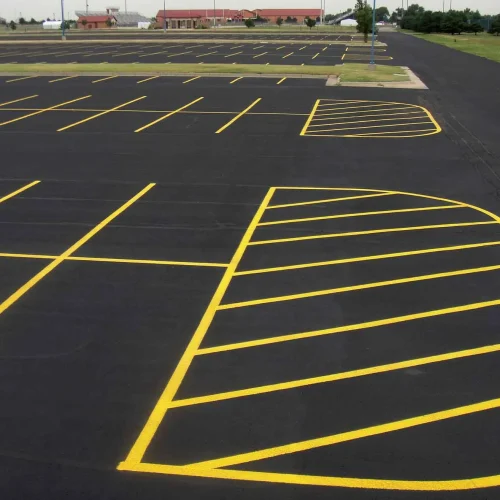 freshly painted yellow parking lot lines at maize high school in maize kansas