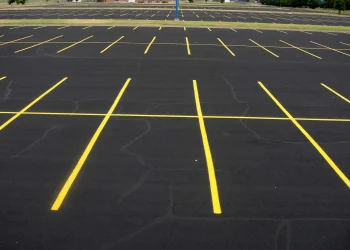freshly painted yellow parking lot lines at maize high school in maize kansas
