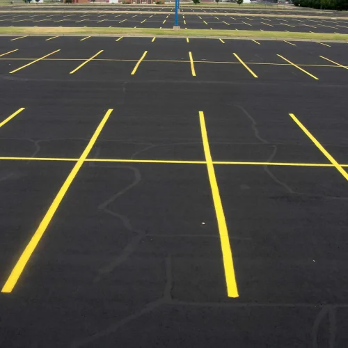 freshly painted yellow parking lot lines at maize high school in maize kansas