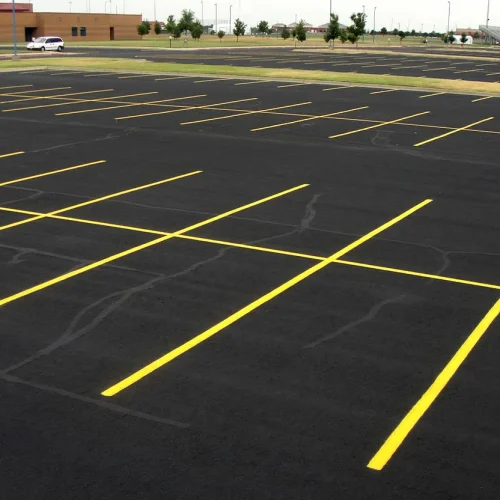 freshly painted yellow parking lot lines at maize high school in maize kansas