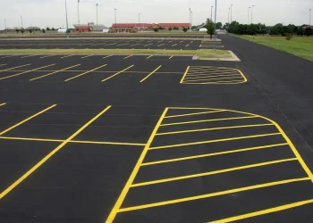 freshly painted yellow parking lot lines at maize high school in maize kansas
