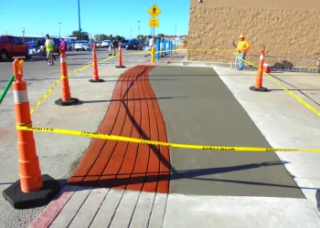 concrete and red brick walkway in front of walmart