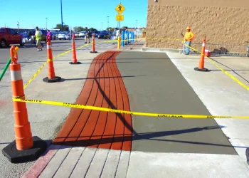 concrete and red brick walkway in front of walmart