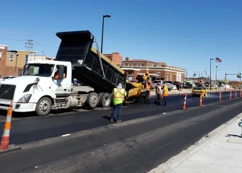 encore pavement employees outside of a dump truck