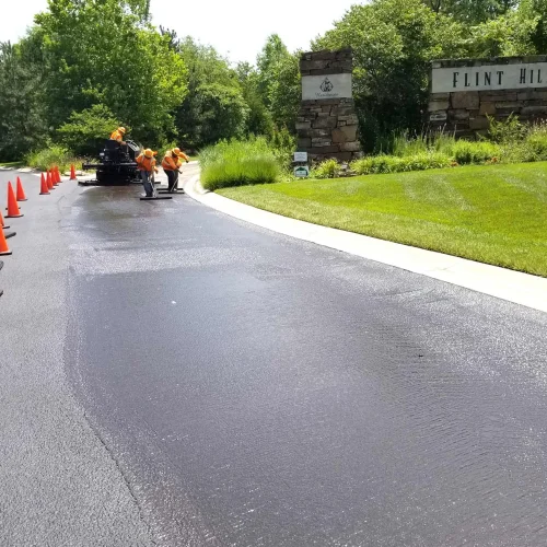 encore pavement employees working on a street