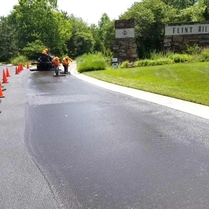 encore pavement employees working on a street