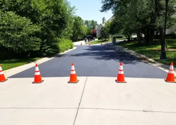 orange and white traffic cones in the street