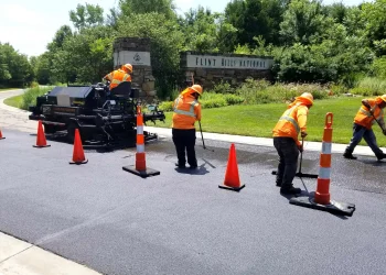 encore pavement employees working at flint hills national golf course