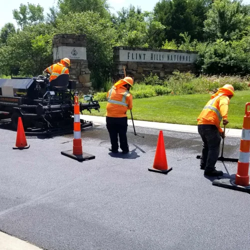 encore pavement employees working at flint hills national golf course