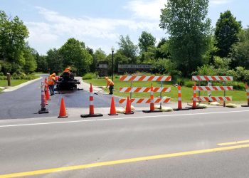 encore pavement employees working at flint hills national golf course