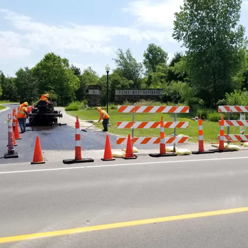 encore pavement employees working at flint hills national golf course