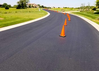 orange traffic cones in the middle of the road