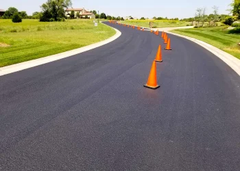 orange traffic cones in the middle of the road