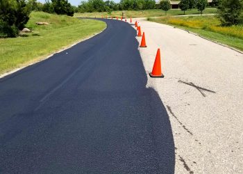 orange traffic cones in the middle of the road