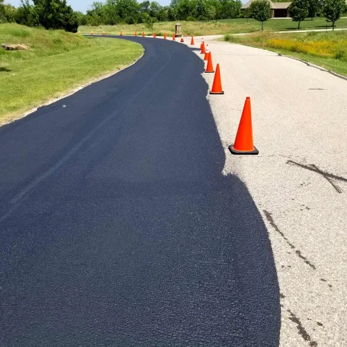 orange traffic cones in the middle of the road