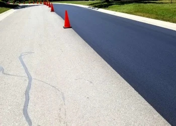 orange traffic cones in the middle of the road