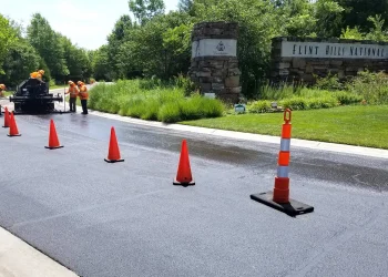 encore pavement employees working on a street