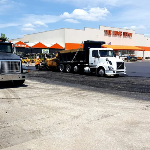 encore pavement dump truck in front of home depot