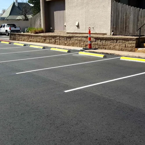 parking spaces and curb stops at horizon east apartments