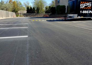 empty parking spaces and speed bump at horizon east apartments