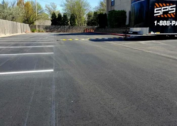 empty parking spaces and speed bump at horizon east apartments