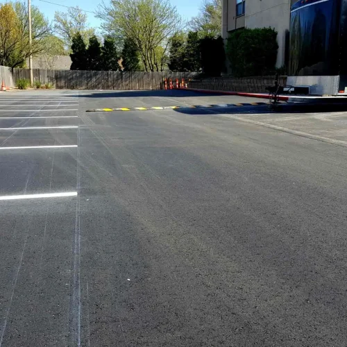 empty parking spaces and speed bump at horizon east apartments